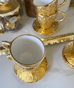 Inspire Me! Home Decor Gold Textured Metal Tea Cup And Saucer With White Interior